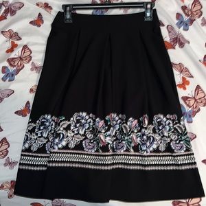 Beautiful Cato knee length skirt. Size: xsmall. Color: black with floral design